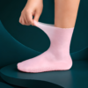 Silicone Moisturizing Socks for Dry & Cracked Heels Pink silicone moisturizing socks designed to soften dry skin and repair cracked heels.
